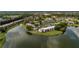 Aerial view of the neighborhood featuring residences near a serene lake at 142 Lakeview Way # 142, Oldsmar, FL 34677