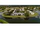 Aerial view showing building exteriors near a lake at 142 Lakeview Way # 142, Oldsmar, FL 34677