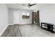 Cozy bedroom featuring neutral walls, ceiling fan, and sliding glass door to balcony at 142 Lakeview Way # 142, Oldsmar, FL 34677