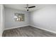 Bright bedroom with neutral walls, ceiling fan and large window offering natural light at 142 Lakeview Way # 142, Oldsmar, FL 34677