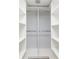 Well organized walk in closet with ample shelving for optimal storage and organization at 142 Lakeview Way # 142, Oldsmar, FL 34677