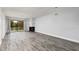 Spacious living room with fireplace and view of the outdoors from sliding glass door at 142 Lakeview Way # 142, Oldsmar, FL 34677