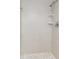 Modern shower with tiled walls, hexagon tiles on the shower floor and recessed shelving at 142 Lakeview Way # 142, Oldsmar, FL 34677
