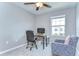This bedroom is a serene space with a cozy chair and a functional desk, perfect for comfort and productivity at 14477 Editors Note St, Ruskin, FL 33573