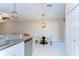 Dining area with a stylish chandelier, and seating for two, located off the kitchen at 14477 Editors Note St, Ruskin, FL 33573