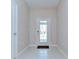 Bright foyer features decorative glass front door, neutral paint, and tile flooring at 14477 Editors Note St, Ruskin, FL 33573