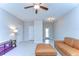 Inviting living room with tile floors, neutral walls, and a comfortable tan couch at 14477 Editors Note St, Ruskin, FL 33573