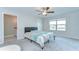 Bright main bedroom with soft carpet and a view, creating a peaceful retreat for rest and relaxation at 14477 Editors Note St, Ruskin, FL 33573