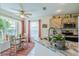 Bright eat-in kitchen featuring a marble countertop, stainless steel appliances, and a large window with natural light at 1618 Nantucket Dr, Sun City Center, FL 33573