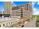 Exterior view of a multi-story building with brick and beige accents, street view, and surrounding high-rise buildings at 175 2Nd S St # 1014, St Petersburg, FL 33701