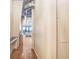 Hallway leading to a modern living area with floor-to-ceiling windows, and view of the outside at 175 2Nd S St # 1014, St Petersburg, FL 33701