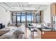 Open concept living space featuring a large window view, comfortable sofa, and breakfast bar seating at 175 2Nd S St # 1014, St Petersburg, FL 33701