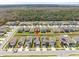 Aerial view of the community featuring nicely landscaped homes with solar panels on the roofs at 17950 Beaming Rays Ln, Lutz, FL 33558