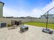 Relaxing backyard features a paved patio perfect for outdoor gatherings and entertaining at 17950 Beaming Rays Ln, Lutz, FL 33558