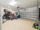 Spacious two car garage with an epoxy floor is great for parking and extra storage at 17950 Beaming Rays Ln, Lutz, FL 33558