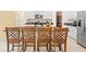 Kitchen island with seating area and stainless steel appliances at 17950 Beaming Rays Ln, Lutz, FL 33558