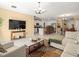 Bright living area with modern decor, open to the kitchen and dining space at 17950 Beaming Rays Ln, Lutz, FL 33558