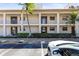 The condo complex features an attractive façade and easy access to parking at 19029 Us Highway 19 N # 2-17, Clearwater, FL 33764