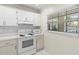 The kitchen boasts a microwave and an oven, offering functionality and style at 19029 Us Highway 19 N # 2-17, Clearwater, FL 33764