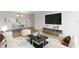 Nicely staged living room with a dining area, a large television, and neutral finishes at 19029 Us Highway 19 N # 2-17, Clearwater, FL 33764