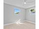 Bright bedroom with two windows and ceiling fan at 1972 Sourwood Blvd, Dunedin, FL 34698