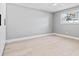 Bedroom featuring hardwood floors and a backyard view at 1972 Sourwood Blvd, Dunedin, FL 34698