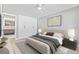 Bedroom featuring a comfortable bed, built-in closet, and access to an en-suite bathroom at 1972 Sourwood Blvd, Dunedin, FL 34698