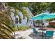 Charming backyard with blue patio, landscaping, and exterior of a cozy home at 210 15Th N Ave, St Petersburg, FL 33704