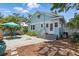 Charming backyard with blue patio, landscaping, and exterior of a cozy home at 210 15Th N Ave, St Petersburg, FL 33704