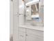 Bright bathroom features white cabinets, drawers, and stainless faucet and hardware at 210 15Th N Ave, St Petersburg, FL 33704