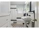 Bathroom features black and white tile, pedestal sink, toilet, and tiled shower at 210 15Th N Ave, St Petersburg, FL 33704