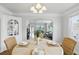 Dining room with arched doorway leading to the living room at 210 15Th N Ave, St Petersburg, FL 33704