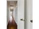 Hallway with hardwood floors and white trim at 210 15Th N Ave, St Petersburg, FL 33704