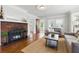 Cozy living room featuring a brick fireplace and stylish decor at 210 15Th N Ave, St Petersburg, FL 33704