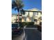 Multi-Gathering residence with a palm tree in front, surrounded by parking space at 224 Red Maple Pl # 224, Brandon, FL 33510