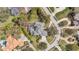Overhead view of a large single-Gathering home, pool, and surrounding landscaped yard and neighborhood at 2280 Mackenzie Ct, Clearwater, FL 33765