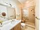Modern bathroom features a glass shower, large vanity mirror, and sleek fixtures at 2280 Mackenzie Ct, Clearwater, FL 33765