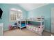 Well-lit bedroom featuring built-in bunk beds near the arched window at 2280 Mackenzie Ct, Clearwater, FL 33765
