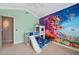 This bedroom features a loft bed with slide and Super Mario Brothers themed wall art at 2280 Mackenzie Ct, Clearwater, FL 33765