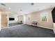 Large bonus room with neutral walls, gray carpet, and large mirrored wall perfect for workout room at 2280 Mackenzie Ct, Clearwater, FL 33765