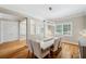 Elegant dining room featuring hardwood floors, natural light, and a modern chandelier at 2280 Mackenzie Ct, Clearwater, FL 33765