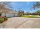 Spacious three-car garage with an extra long driveway and basketball hoop, perfect for car enthusiasts and outdoor play at 2280 Mackenzie Ct, Clearwater, FL 33765