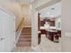Inviting kitchen with island, stainless appliances, range hood and staircase with access to second floor at 2280 Mackenzie Ct, Clearwater, FL 33765