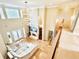 Bright living room with high ceilings, a fireplace, and large windows offering plenty of natural light at 2280 Mackenzie Ct, Clearwater, FL 33765
