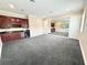 Entertainment room boasts a kitchenette with dark cabinets and a mirrored wall, perfect for gatherings at 2280 Mackenzie Ct, Clearwater, FL 33765