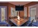 Enjoy an evening outside at the built-in gas firepit on the table with a wall-mounted television at 2280 Mackenzie Ct, Clearwater, FL 33765
