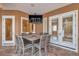 Covered patio featuring an outdoor dining area with a fire pit and a mounted TV at 2280 Mackenzie Ct, Clearwater, FL 33765