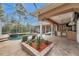 Enjoy the pool, spa, and outdoor kitchen on the covered patio for great entertainment and relaxation at 2280 Mackenzie Ct, Clearwater, FL 33765