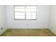 Modest bedroom with a window and carpeted floors at 24862 Us Highway 19 N # 2801, Clearwater, FL 33763