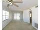 Spacious living room with large windows, sliding glass doors, and neutral carpeting at 24862 Us Highway 19 N # 2801, Clearwater, FL 33763